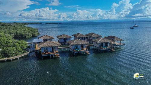 an aerial view of a resort in the water at CoralBay Bungalows Solarte in Solarte