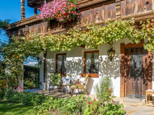 a house with a table and chairs on a patio at Johanna und Sonja in Scheffach