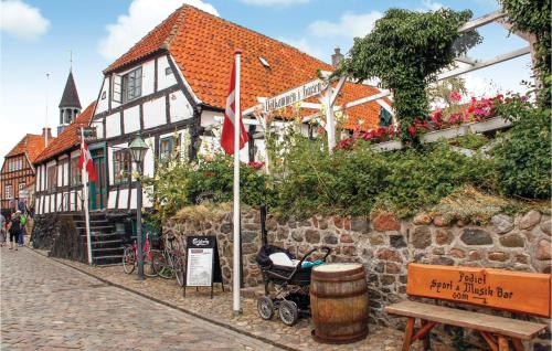 a building with a stroller in front of a street at Apartment Nytorv in Ebeltoft
