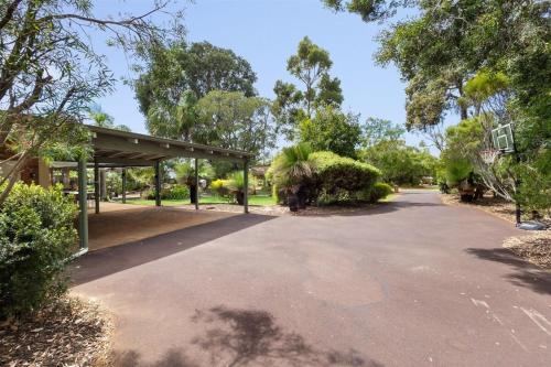 a parking lot with a pavilion in a park at Dandjoo - hot tub, fire pit, outdoor entertainment in Dunsborough