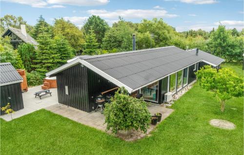 an overhead view of a black house with a garden at Awesome Home In Ebeltoft With Sauna in Ebeltoft
