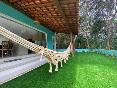 Taman di luar Casa de praia deslumbrante em Massarandupió