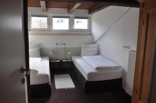 Un ou plusieurs lits dans un hébergement de l'établissement Appartement Elisabeth