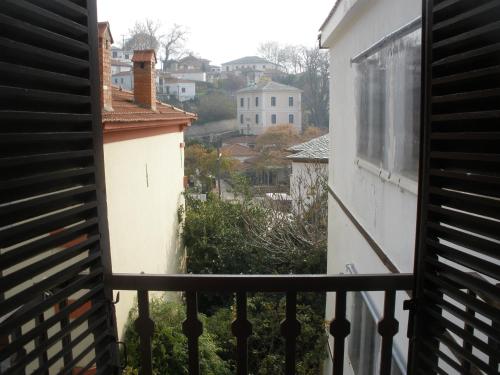 a view of a city from a balcony at Pelias Hotel in Portariá