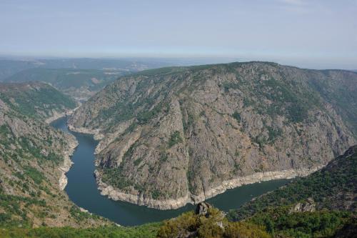 an aerial view of a mountain with a lake at A Casa da Eira in Cerreda