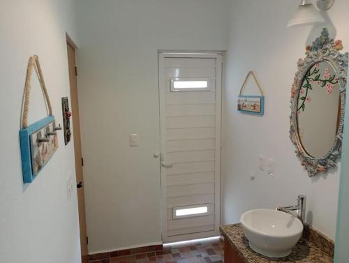 a bathroom with a sink and a mirror at Manzanillo BNB in Manzanillo