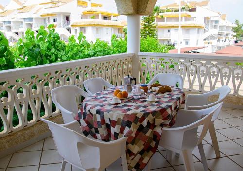 a table on a balcony with a table and chairs at Euromar II - TEPINSA Alquiler de Apartamentos in Torreblanca