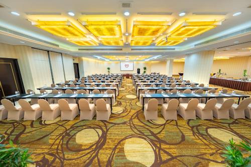 a conference room with tables and chairs in it at Saigon Prince Hotel in Ho Chi Minh City