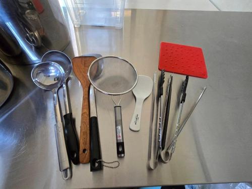a group of kitchen utensils sitting on top of a counter at Lakeforest B&B in Yuanshan