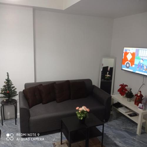 TV a/nebo společenská místnost v ubytování Joanne Sweet Home