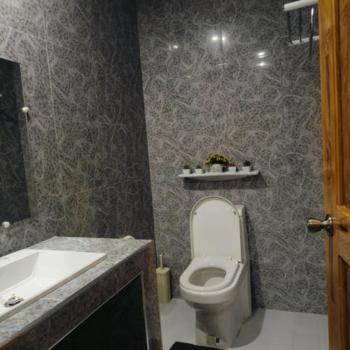 a bathroom with a toilet and a sink at E&N Paradise Island Resort in Siquijor