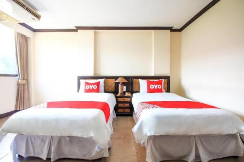 Un ou plusieurs lits dans un hébergement de l'établissement OYO 383 White inn hotel