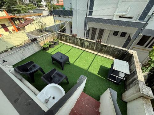an aerial view of a balcony with aificialificialificialificialificialificialificialificial at Ritu Homestay in Trivandrum