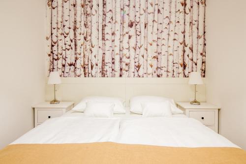 Кровать или кровати в номере WH Apartments