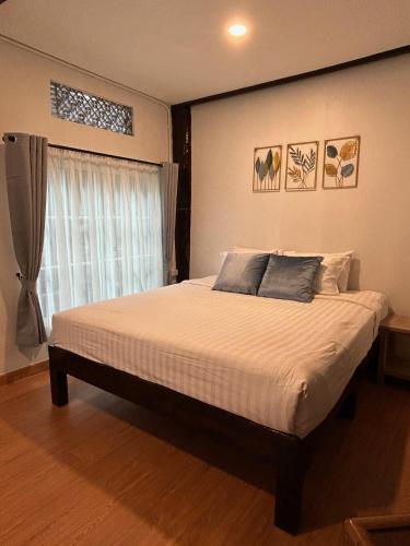 Ένα ή περισσότερα κρεβάτια σε δωμάτιο στο OON homestay