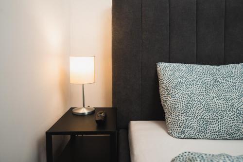 Ένα ή περισσότερα κρεβάτια σε δωμάτιο στο Naphegy Apartments