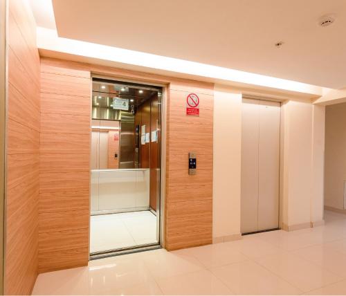 an elevator in a building with a no entry sign at Skyliving Towers Apartments - Perú in Lima