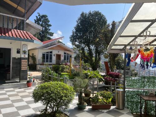 a house with a courtyard with potted plants at Bahar Retreat And Spa , Gangtok in Gangtok
