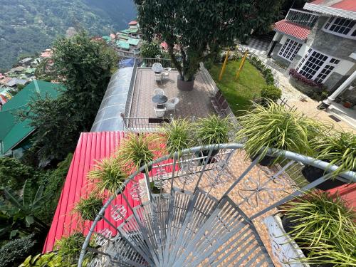 an overhead view of a patio with tables and plants at Bahar Retreat And Spa , Gangtok in Gangtok