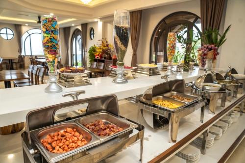 a buffet line with many different types of food at Maris Beach Hotel Phu Quoc in Phu Quoc