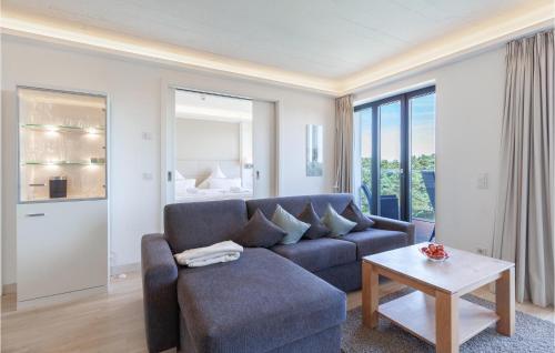 a living room with a couch and a table at Prince in Binz