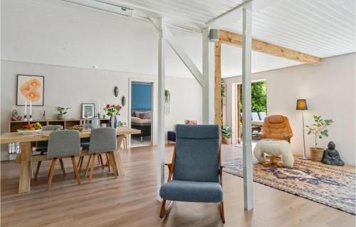 a dining room and living room with a table and chairs at Beautiful Home In Fredensborg With Wifi in Fredensborg