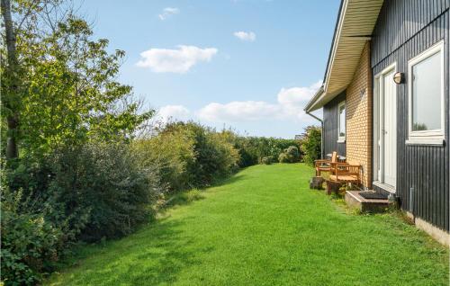 an empty yard next to a house at 3 Bedroom Awesome Home In Kalundborg in Kalundborg