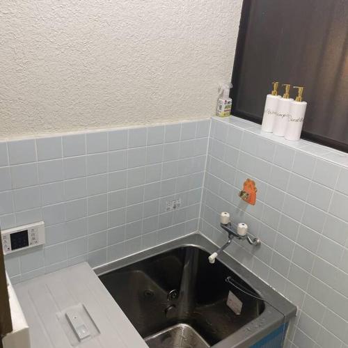 Ein Badezimmer in der Unterkunft 独栋日式别墅巴士直达迪斯尼