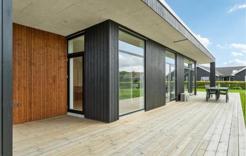 an external view of a house with a wooden deck at Beautiful Home In Nordborg With Wifi in Nordborg