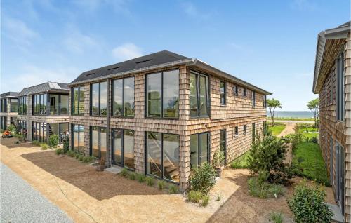 an exterior view of a house with windows at 2 Bedroom Cozy Apartment In Kerteminde in Kerteminde