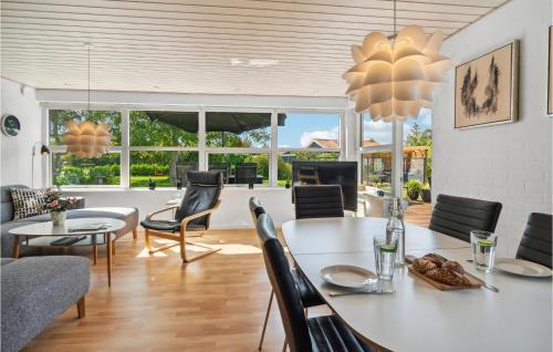a dining room with a table and chairs at Lovely Home In Karrebæksminde With Wifi in Karrebæksminde