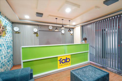 a reception room with a job rights sign and a table at FabHotel Galaxy Heights - Nagavara in Bengaluru