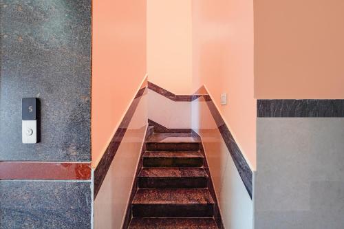 a stairway in a building with at FabHotel Galaxy Heights - Nagavara in Bengaluru