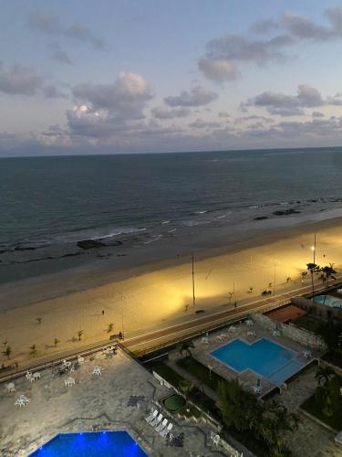 an aerial view of a beach with two swimming pools at Flat Gold Beach in Recife