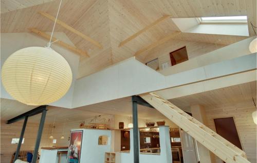 a staircase in a room with a vaulted ceiling at Amazing Home In Sejerø With Kitchen in Sejerby