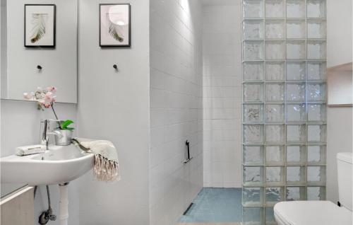 a bathroom with a toilet and a sink at Amazing Home In Sejerø With Kitchen in Sejerby