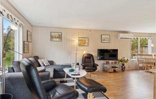 a living room with a couch and a table at Gorgeous Home In Farsø With Wifi in Farsø