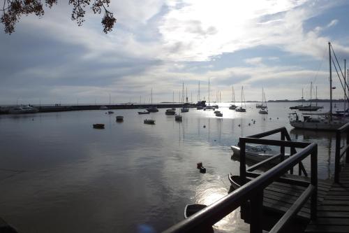 a body of water with boats in the water at Don Antonio Posada in Colonia del Sacramento