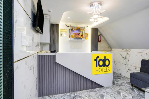 a fast food restaurant with a yellow sign on a counter at FabHotel RR Residency - Near BKC in Mumbai