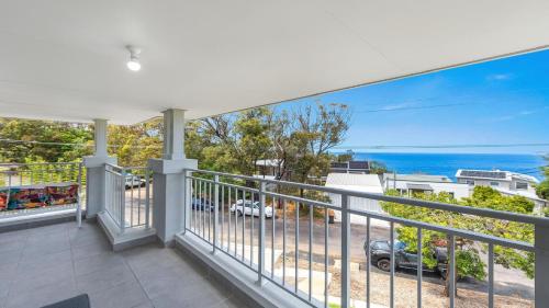 a balcony with a view of the ocean at 'Coastal Ambience' by HolidayCo in Hardys Bay