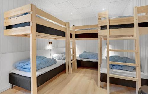 a bunk bed room with two bunk beds at Amazing Home In Fårevejle With Sauna in Fårevejle