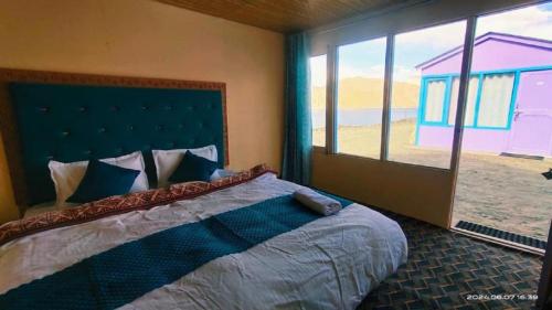 Voodi või voodid majutusasutuse Oasis Retreat Pangong toas