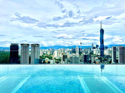 a swimming pool with a view of a city at Riveria City near KL Sentral with 118 view Sky Infinity Pool by COBNB in Kuala Lumpur