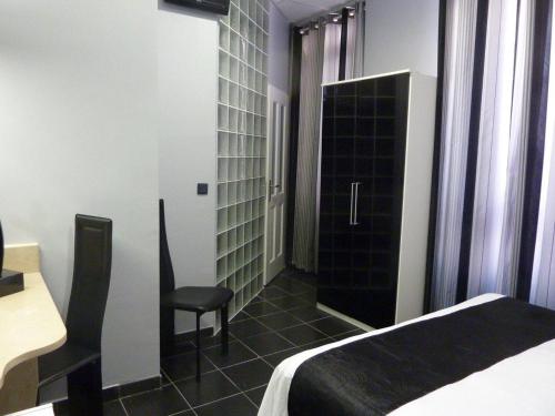 Кровать или кровати в номере Hôtel Villa Boeri