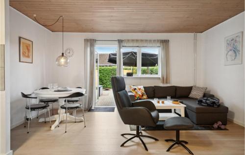 a living room with a couch and a table at Cozy Apartment In Middelfart With Wifi in Middelfart