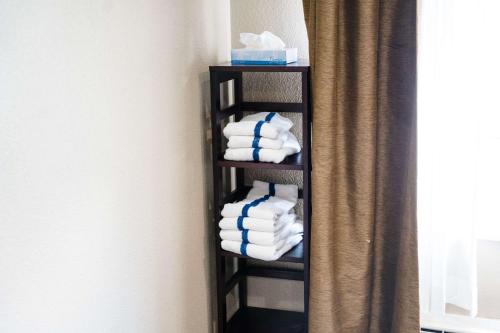 a towel rack with towels in a bathroom at Sleep Inn & Suites West Knoxville in Knoxville