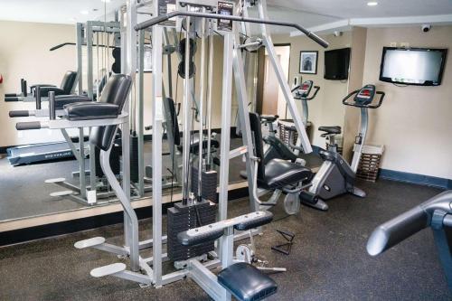 a gym with a row of tread machines at Sleep Inn & Suites West Knoxville in Knoxville