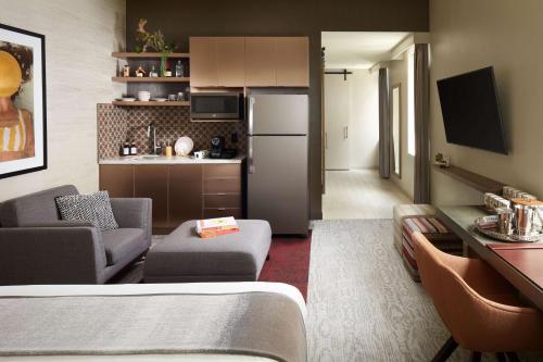 a room with a kitchen and a living room at THesis Hotel Miami Coral Gables, Curio Collection by Hilton in Miami