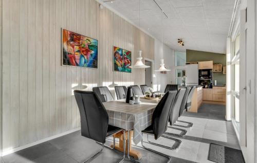 a dining room with a table and chairs at Gorgeous Home In Blåvand With Sauna in Blåvand