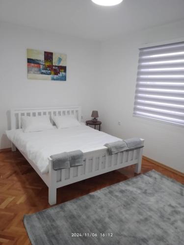 Katil atau katil-katil dalam bilik di Mila apartments